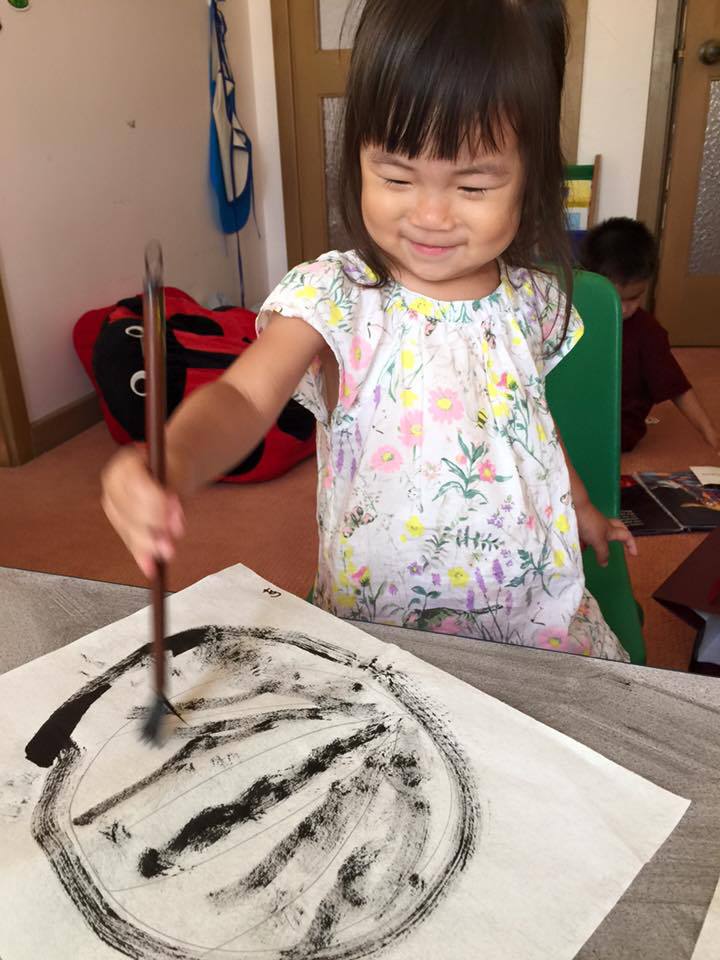 Child Using Paint Brush, Transitional Kindergarten in San Francisco CA