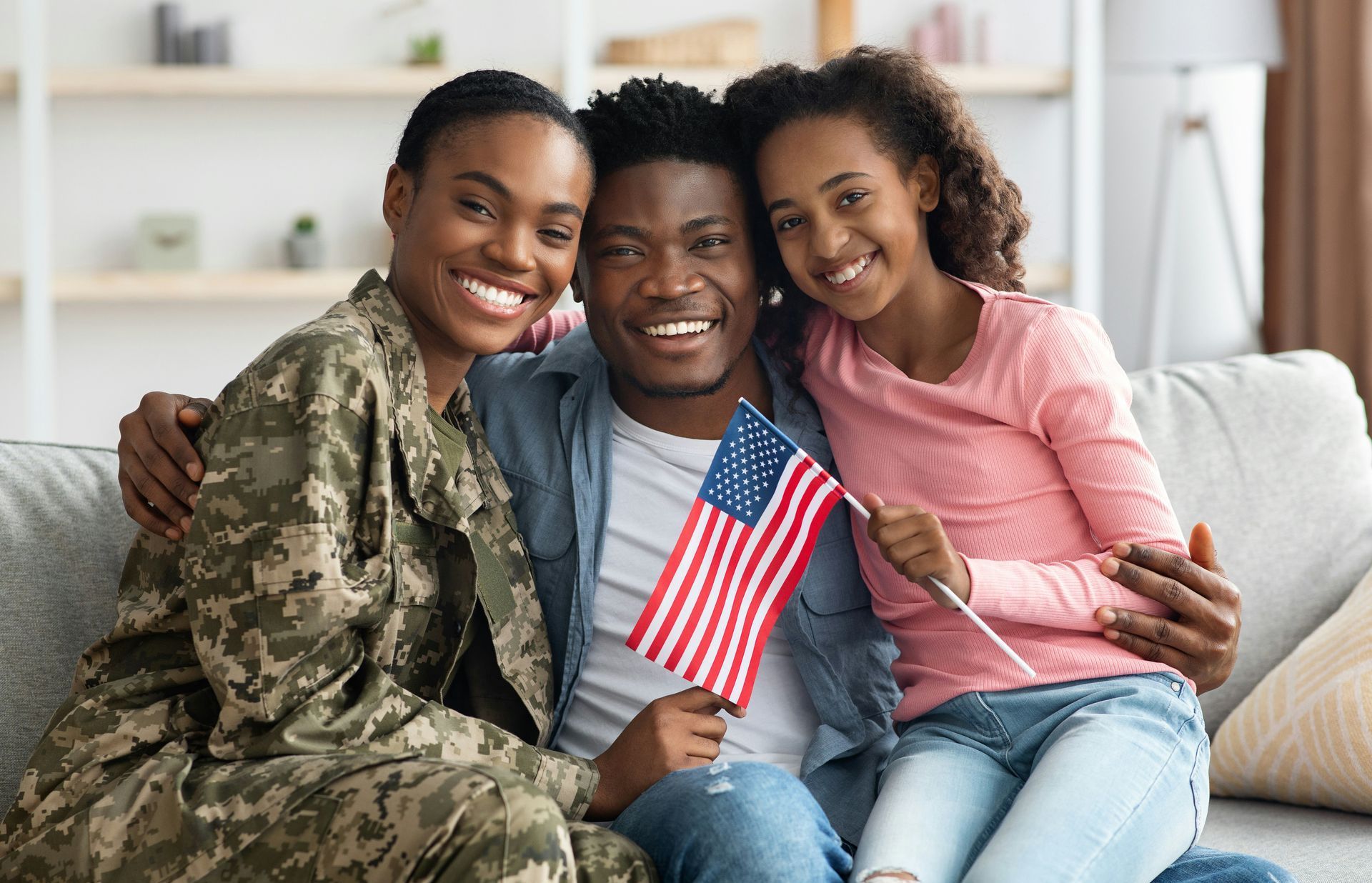 A woman in a blue shirt is serving food to another woman.