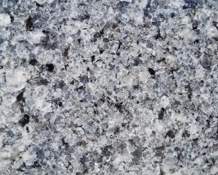 Gray speckled granite stone surface with black and white flecks