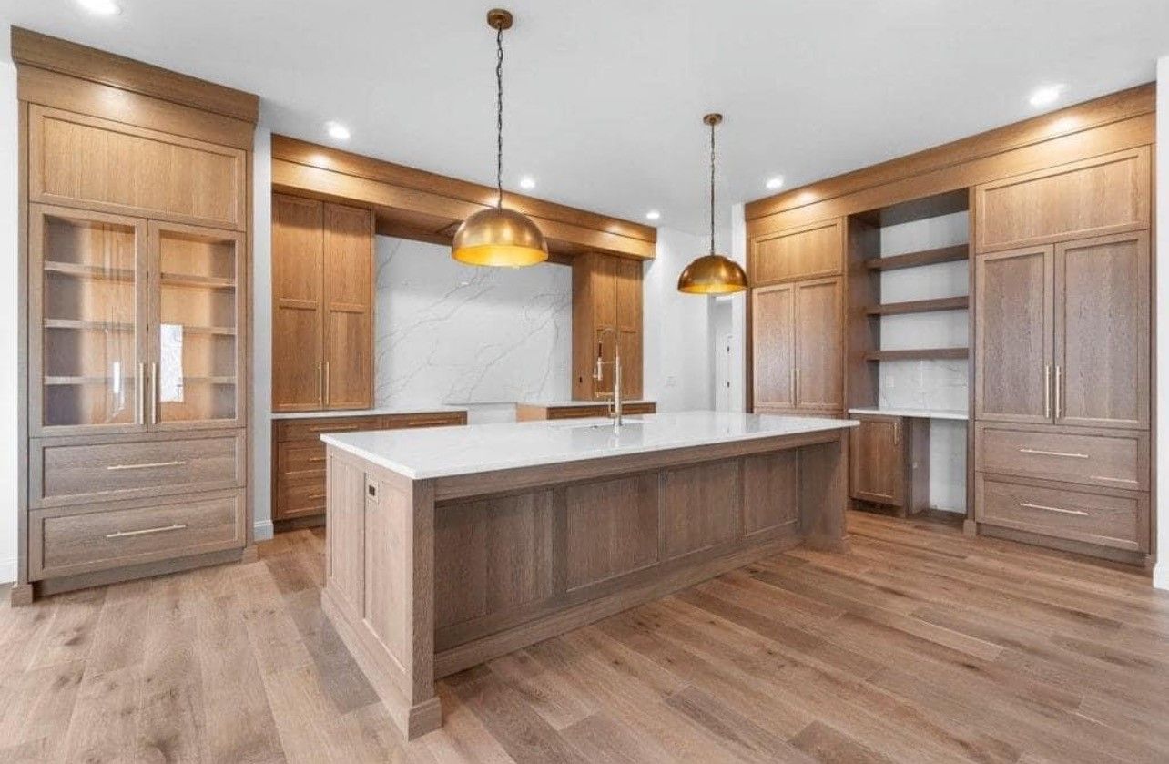 There is a large island in the middle of the kitchen.