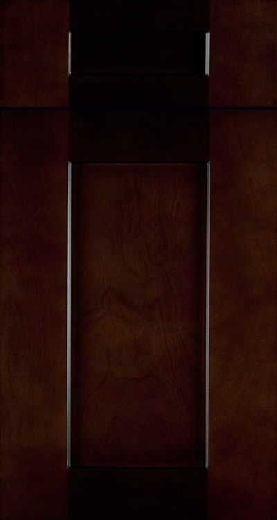 A kitchen with dark wood cabinets and a wine rack