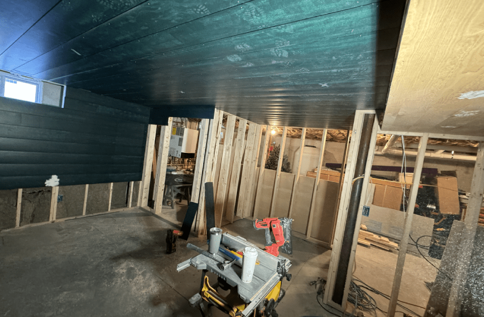 There is a table saw in the middle of the room.