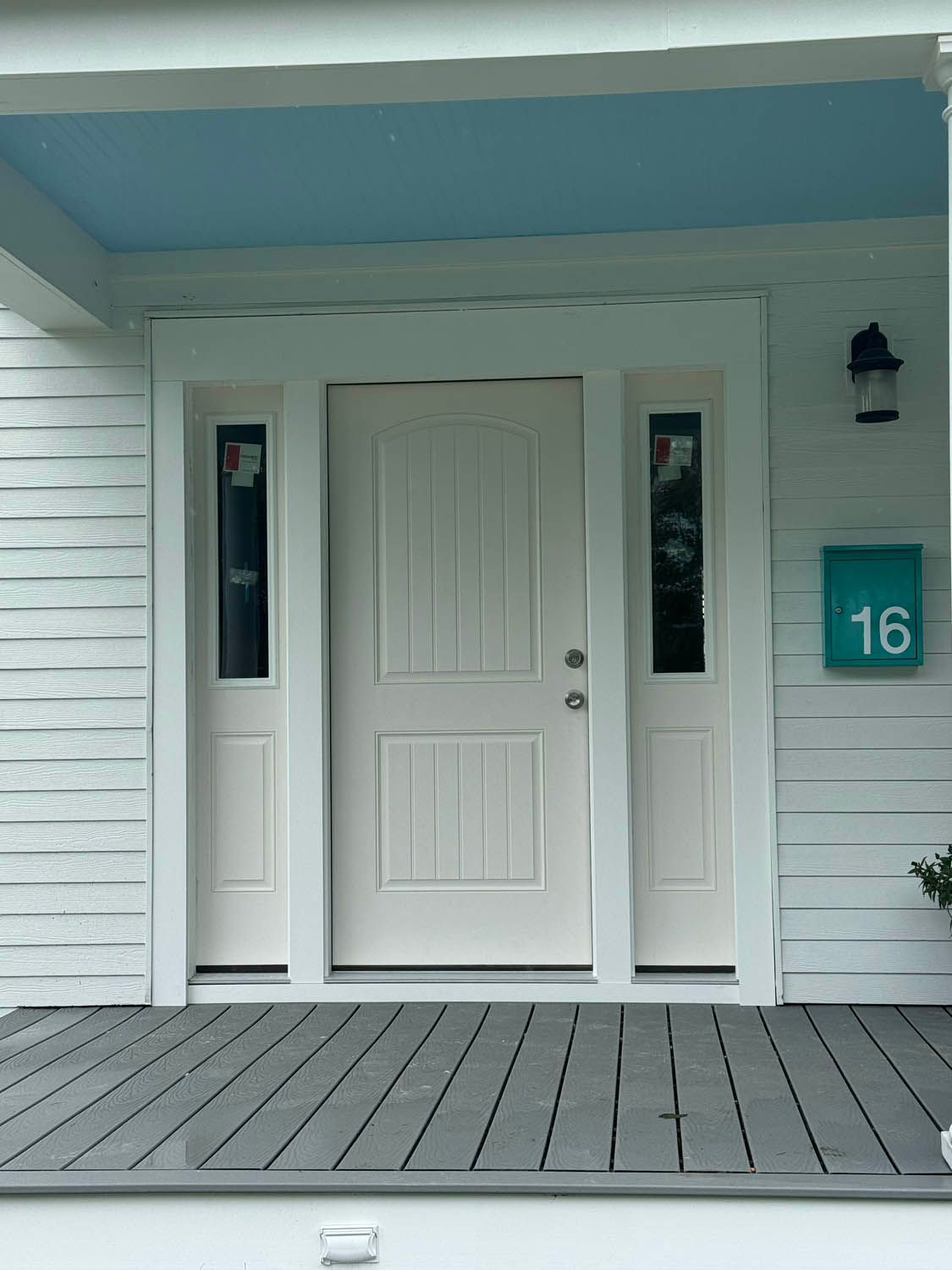 The front door of a house with the number 16 on it