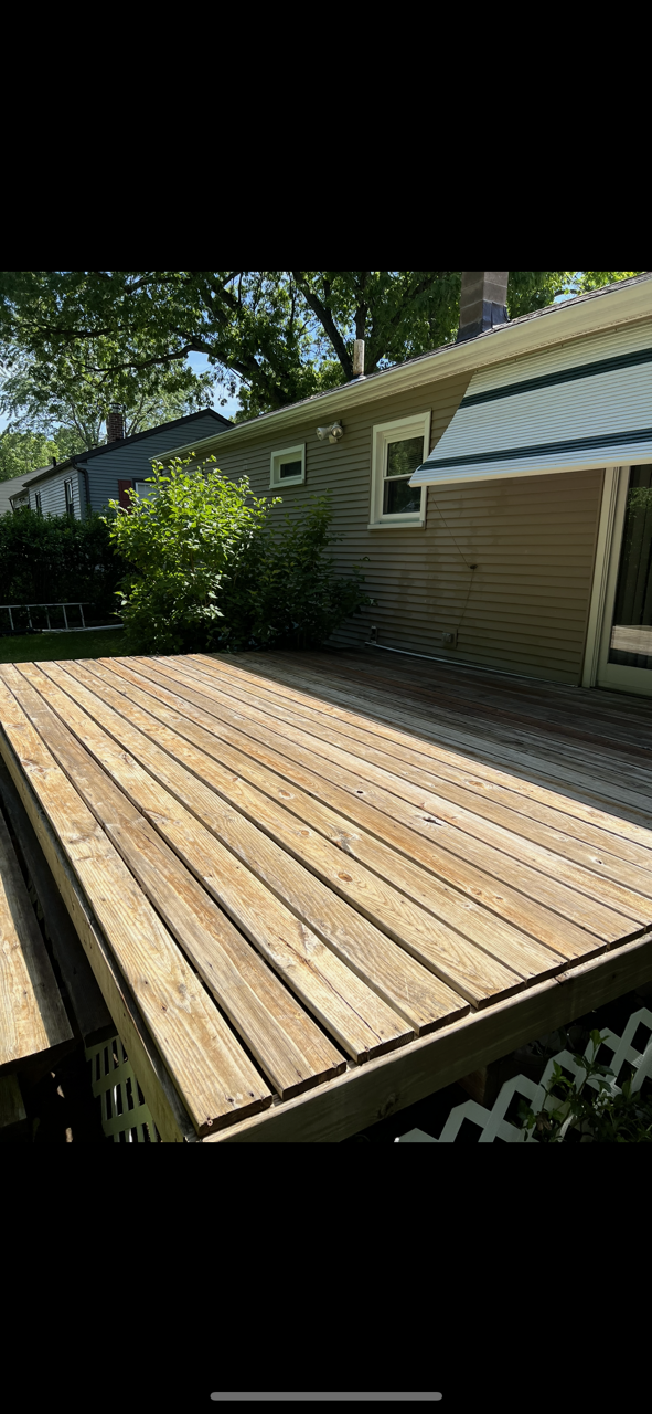 Wooden deck beside a house.