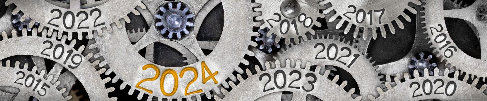 A group of gears with the numbers 2022 , 2023 , 2024 and 2025 on them.