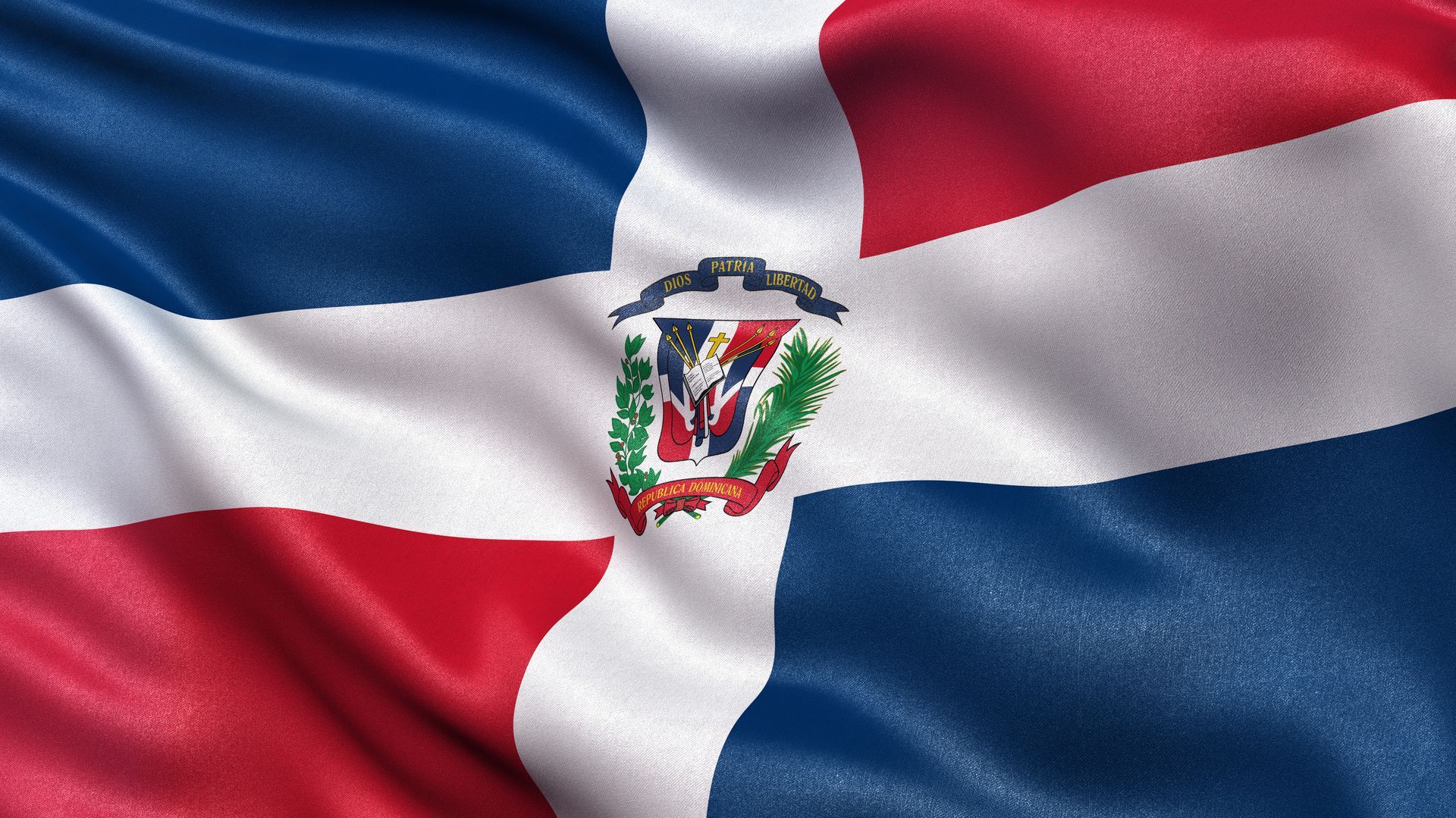 A close up of a dominican flag waving in the wind