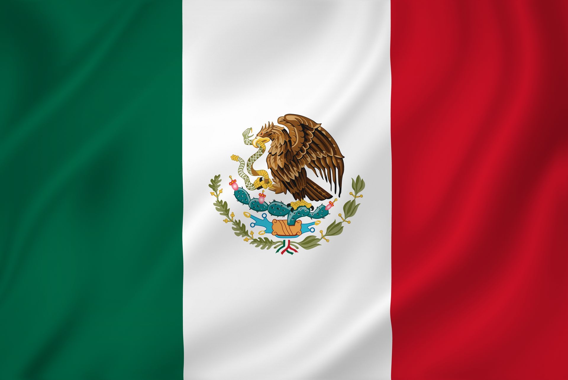 A close up of a mexican flag with an eagle on it.