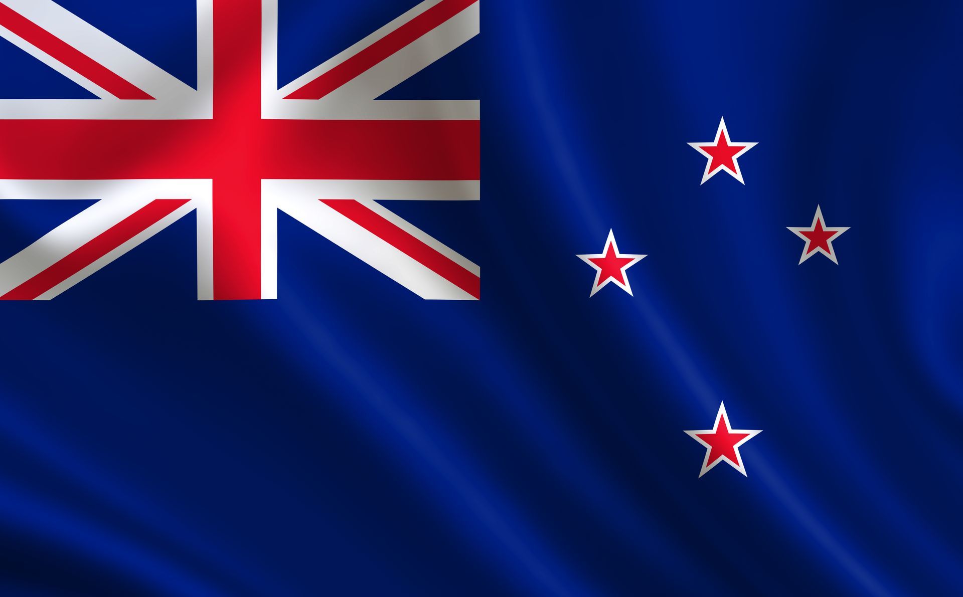 The flag of new zealand is waving in the wind