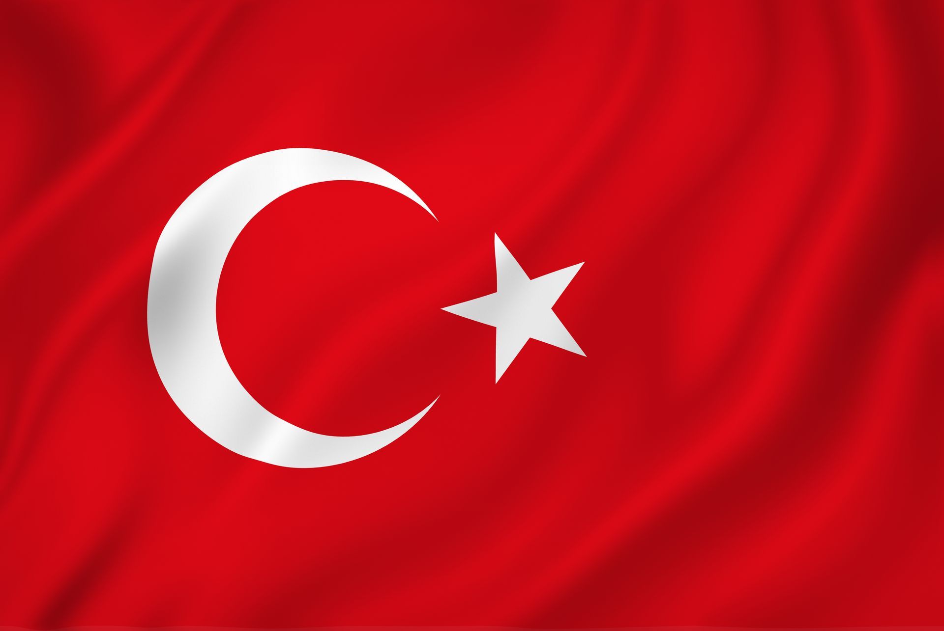 The flag of turkey has a crescent moon and a star on it.