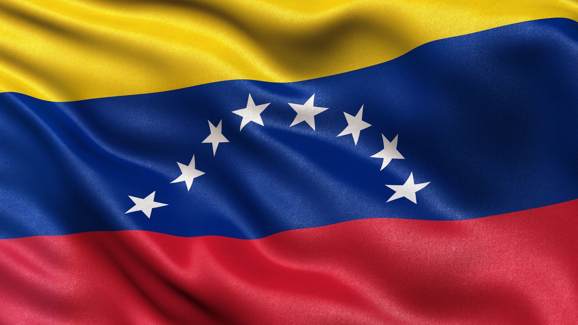 A close up of a venezuelan flag waving in the wind