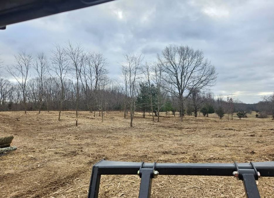 A bulldozer is being towed by a tow truck.
