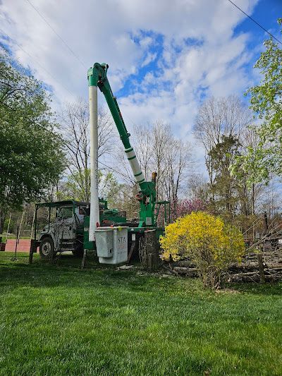 A bulldozer is digging a hole in a dirt field.
