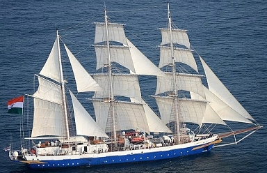 A large sailboat with a flag on the side of it