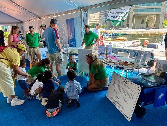 A group of men are standing in front of a building playing drums.