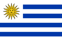 The flag of uruguay is blue and white with a yellow sun on it.