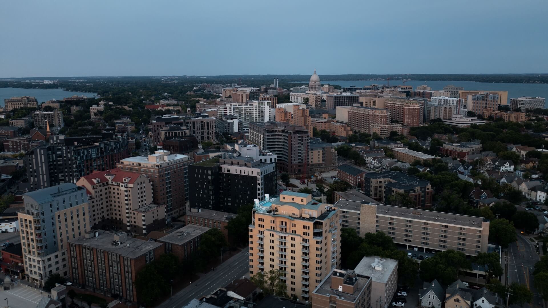 An aerial view of a city with lots of buildings and trees