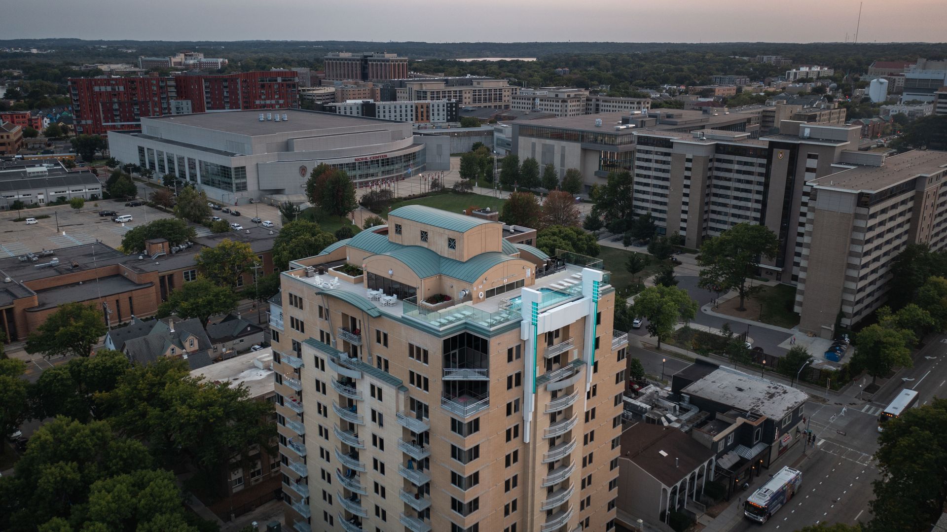 An aerial view of a swimming pool on the roof of a building