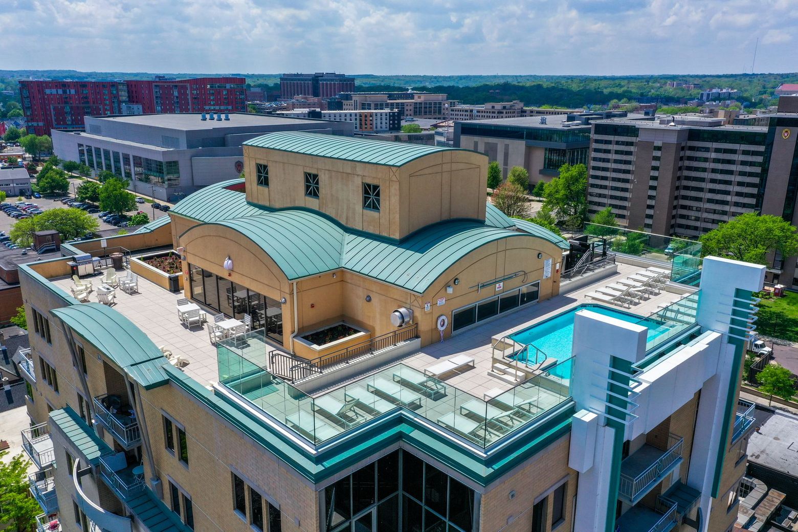 An aerial view of a swimming pool on the roof of a building
