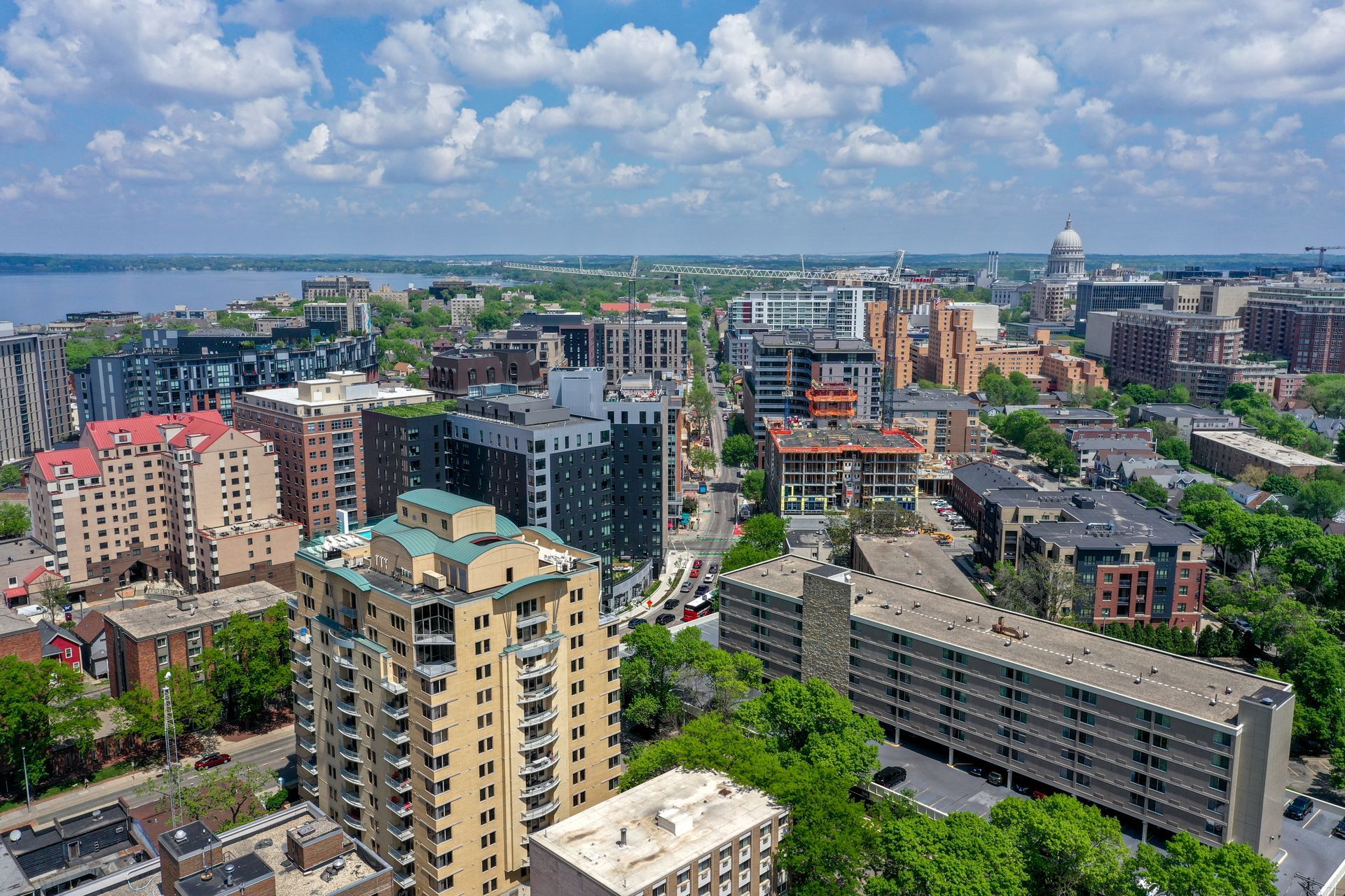 An aerial view of a city with lots of buildings and trees.