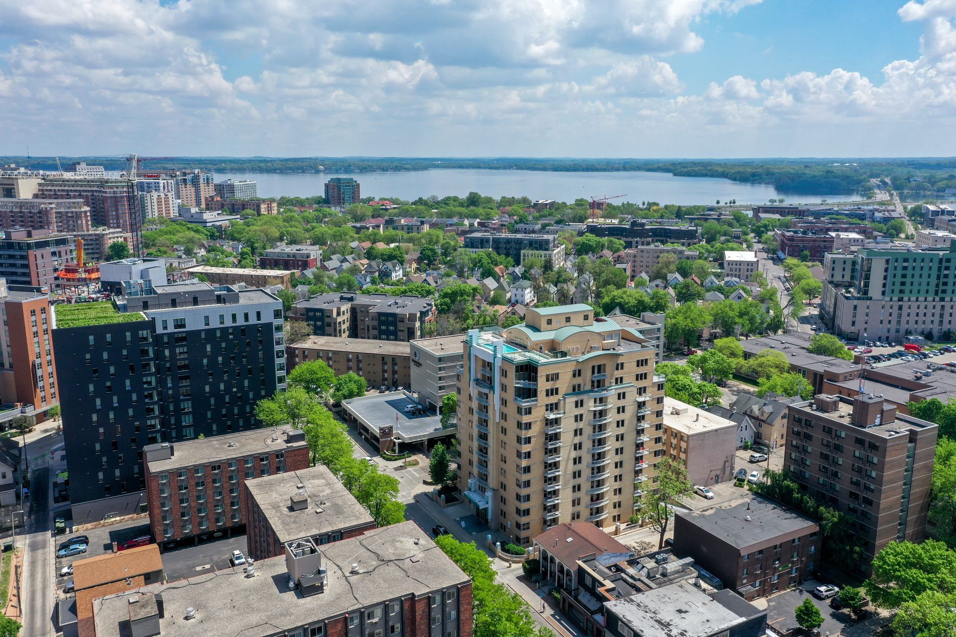 An aerial view of a city with a lake in the background