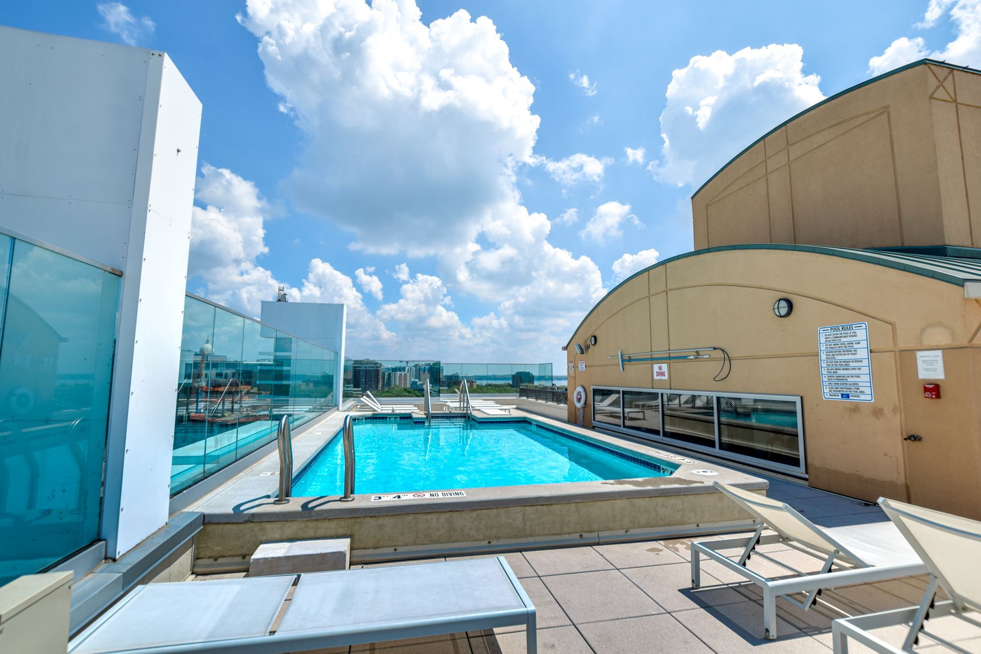 A large swimming pool on the roof of a building