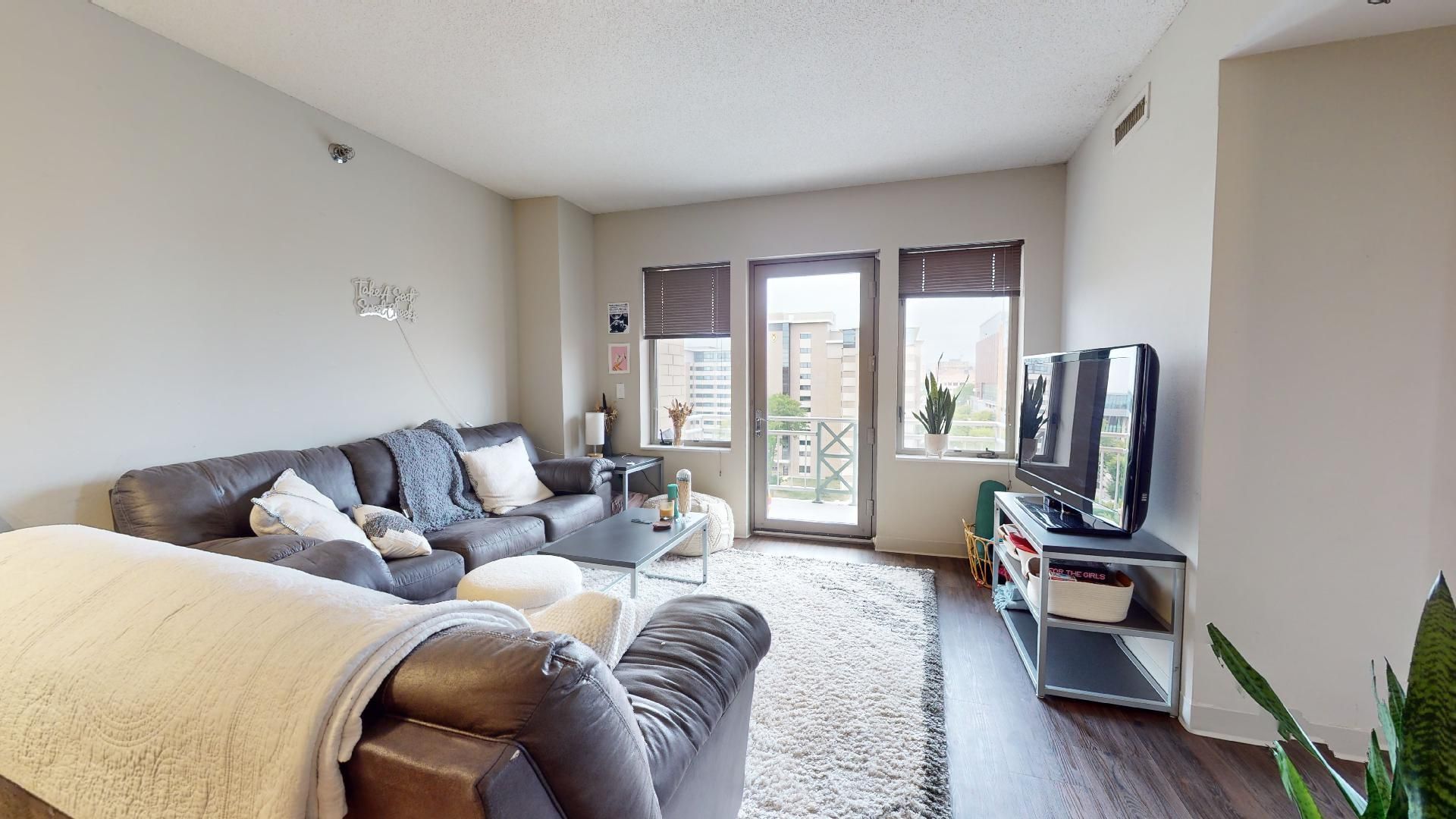 A living room with a couch and a television