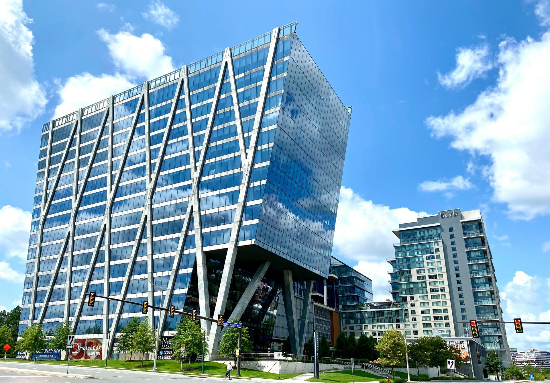 A very tall building with a lot of windows and a sign that says ' united states postal service ' on it