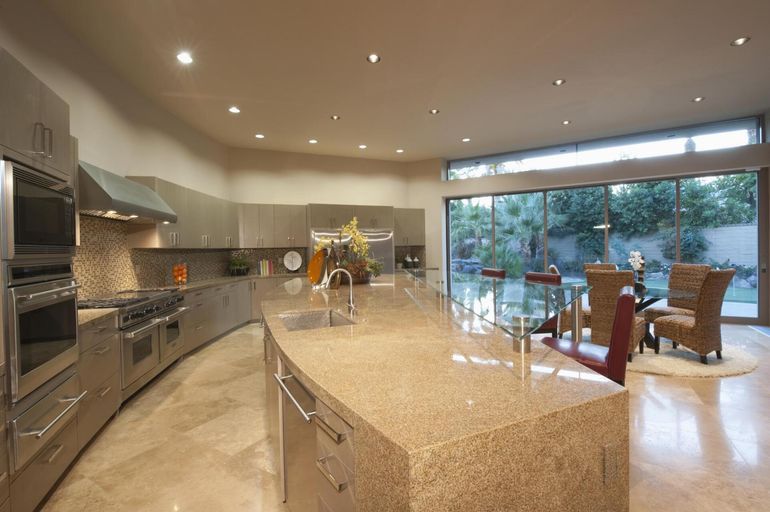 a kitchen with marbled countertops