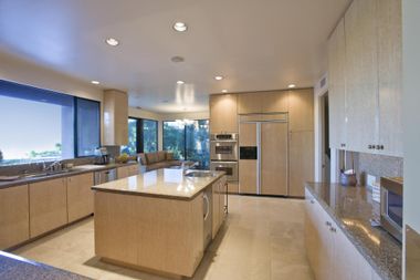 a kitchen with tiled countertops