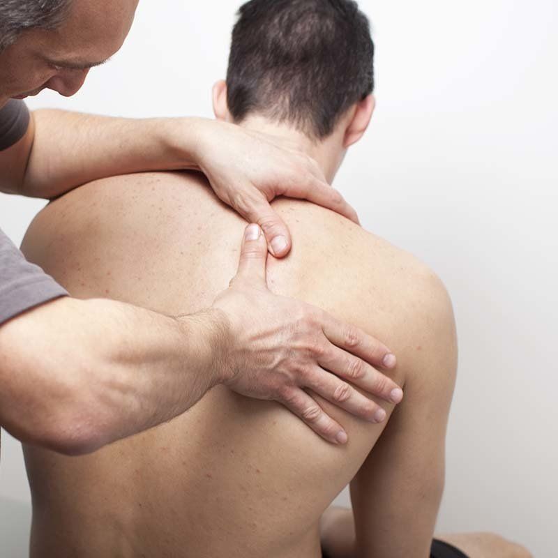 person having their back examined