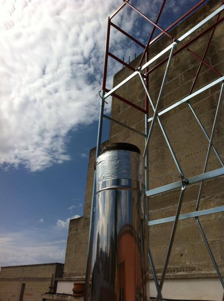 canna fumaria acciaio con impalcatura dopo