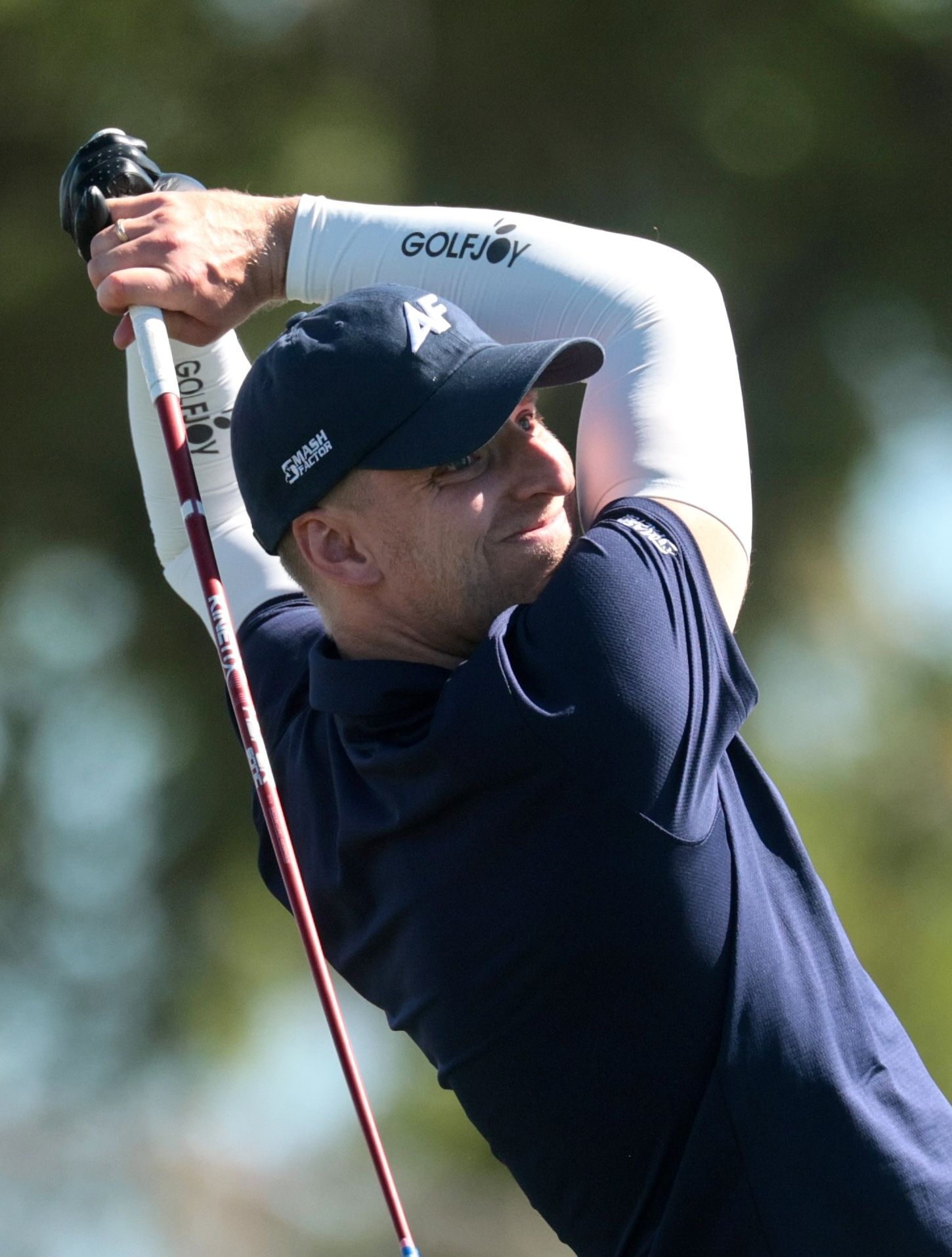 Golfer swinging a club.