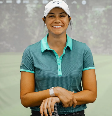 A woman wearing a yellow hat is sitting on a bench