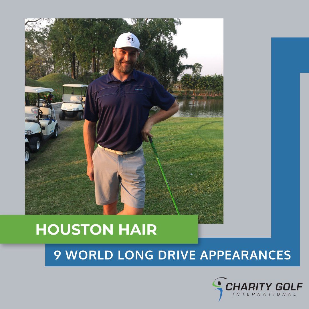 A man is holding a golf club on a golf course