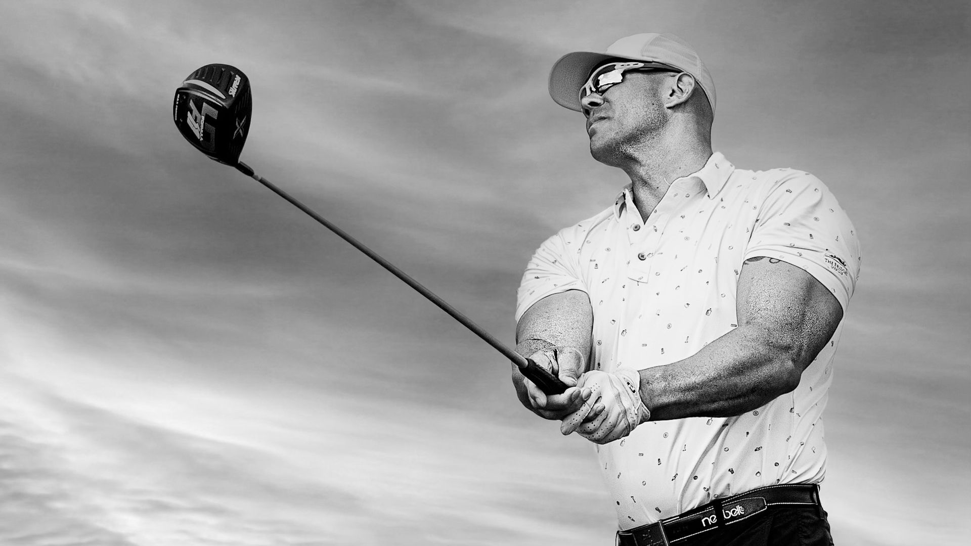 A man holding a trophy that says wild on it