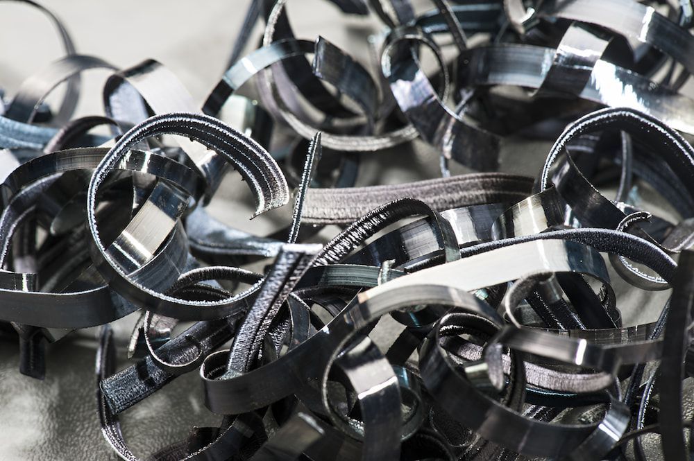 A Pile Of Shredded Metal Is Sitting On A Table — Antons Recycling In Ciccone, NT