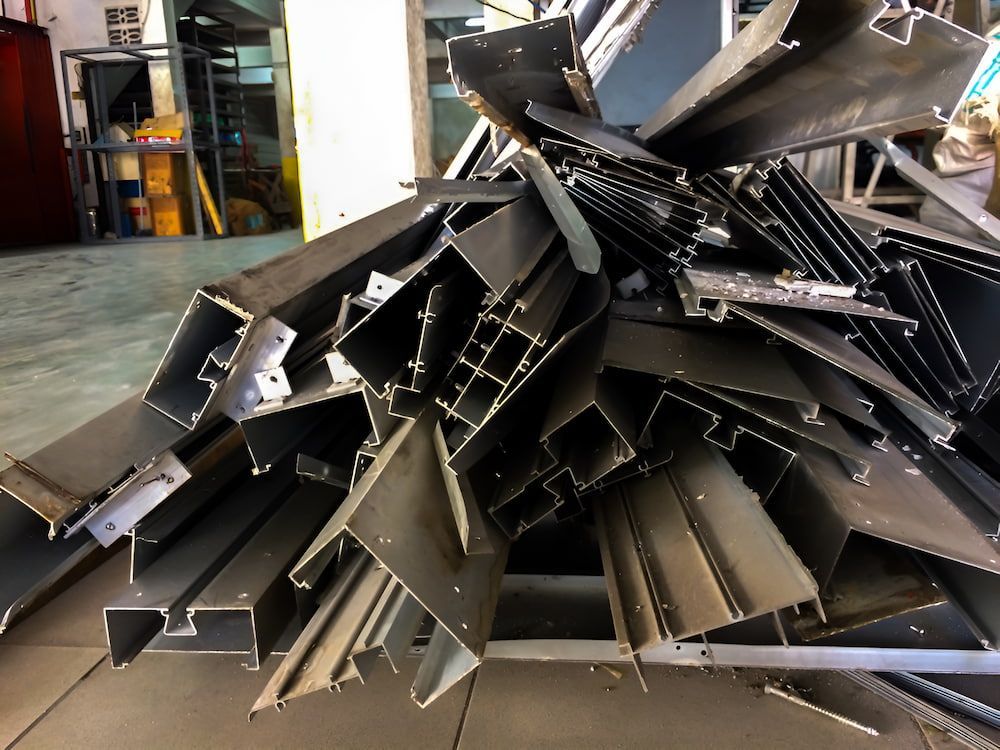 A Pile Of Metal Pieces Are Stacked On Top Of Each Other — Antons Recycling In Ciccone, NT