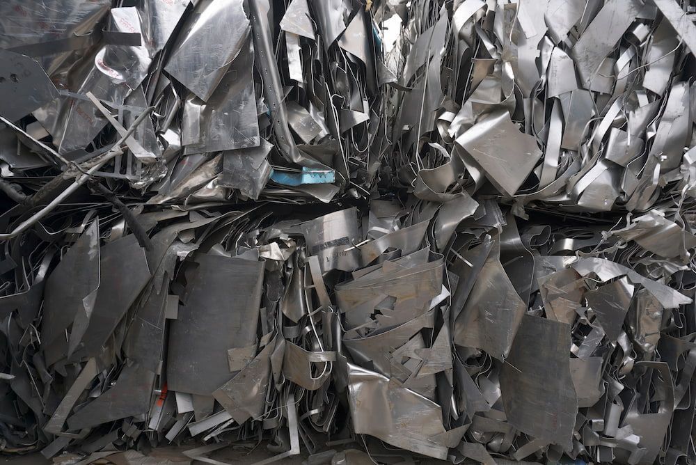 A Pile Of Scrap Metal Is Sitting On Top Of Each Other — Antons Recycling In Ciccone, NT