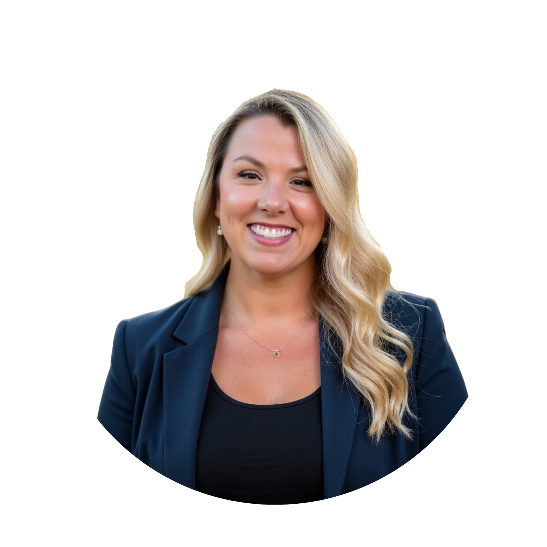 Woman with blonde hair wearing a navy blazer and black top smiles at the camera.