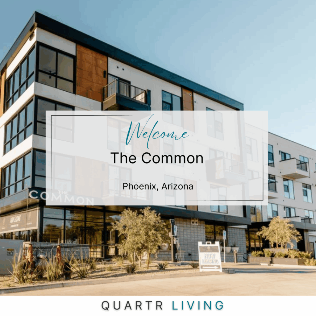 Modern apartment building with a sign that reads 