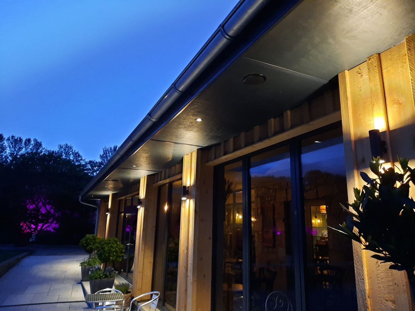 A building with a lot of windows is lit up at night