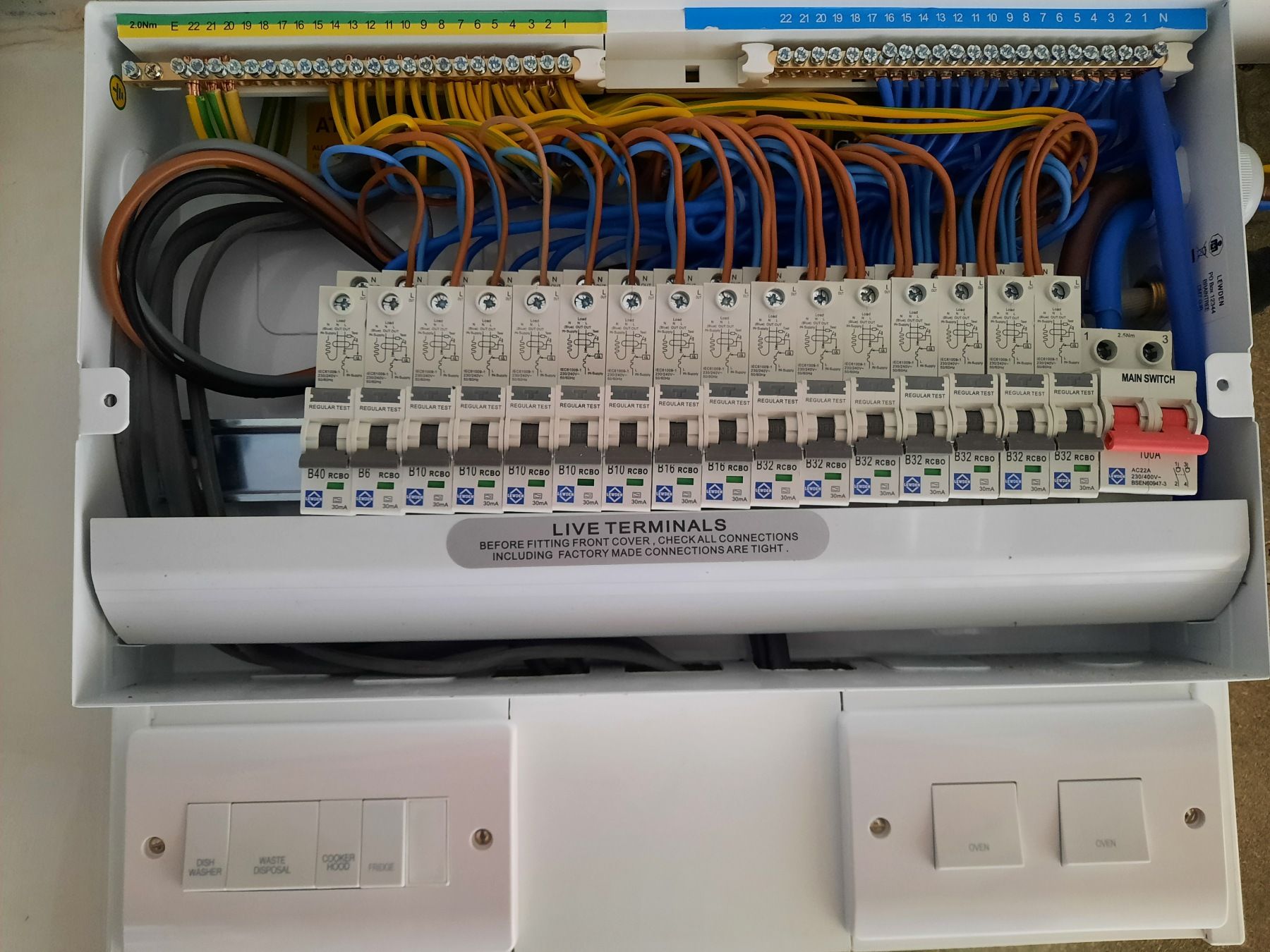 A white box with a lot of wires in it