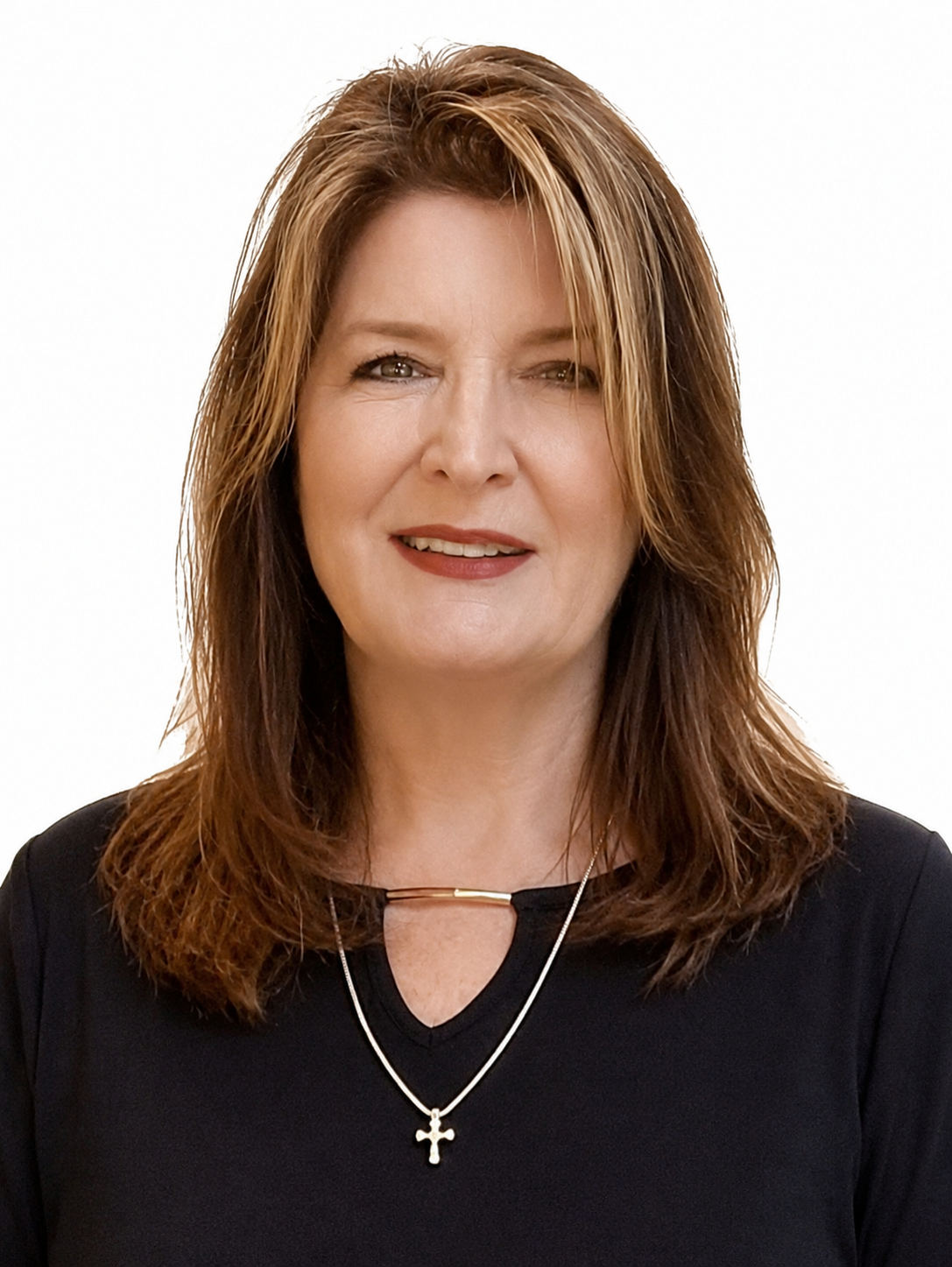 Studio headshot of a woman in a black top and necklace against a white background