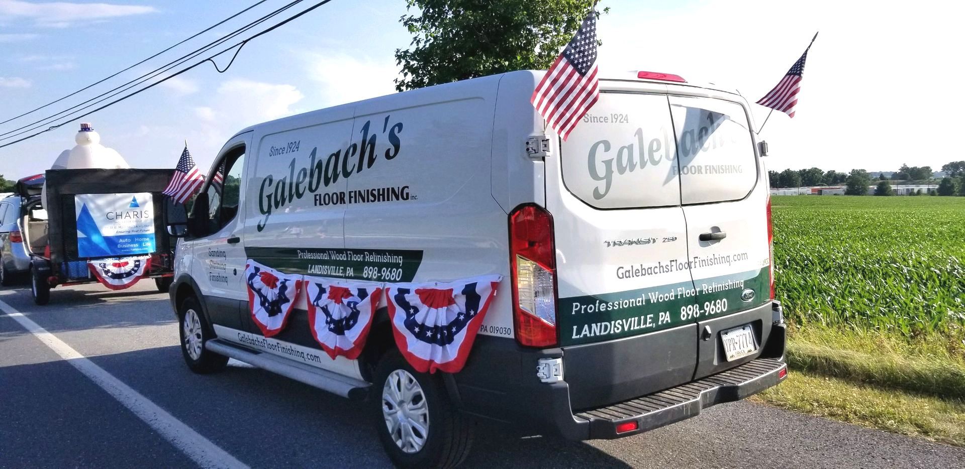 A white Galebach’s Floor Finishing van is parked on the side of the road.