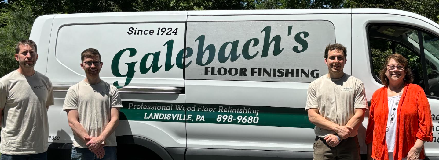 A group of people standing in front of a galebach 's floor finishing van Galebach’s Floor Finishing