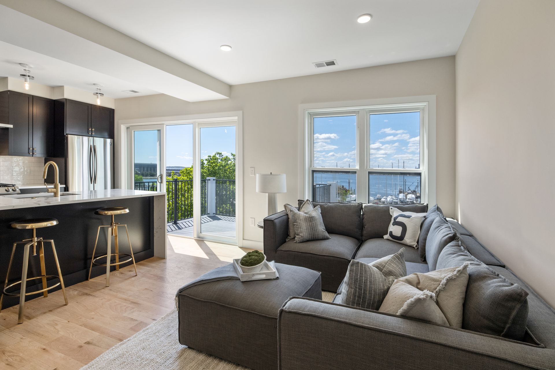 A living room with a couch , coffee table , and stools.