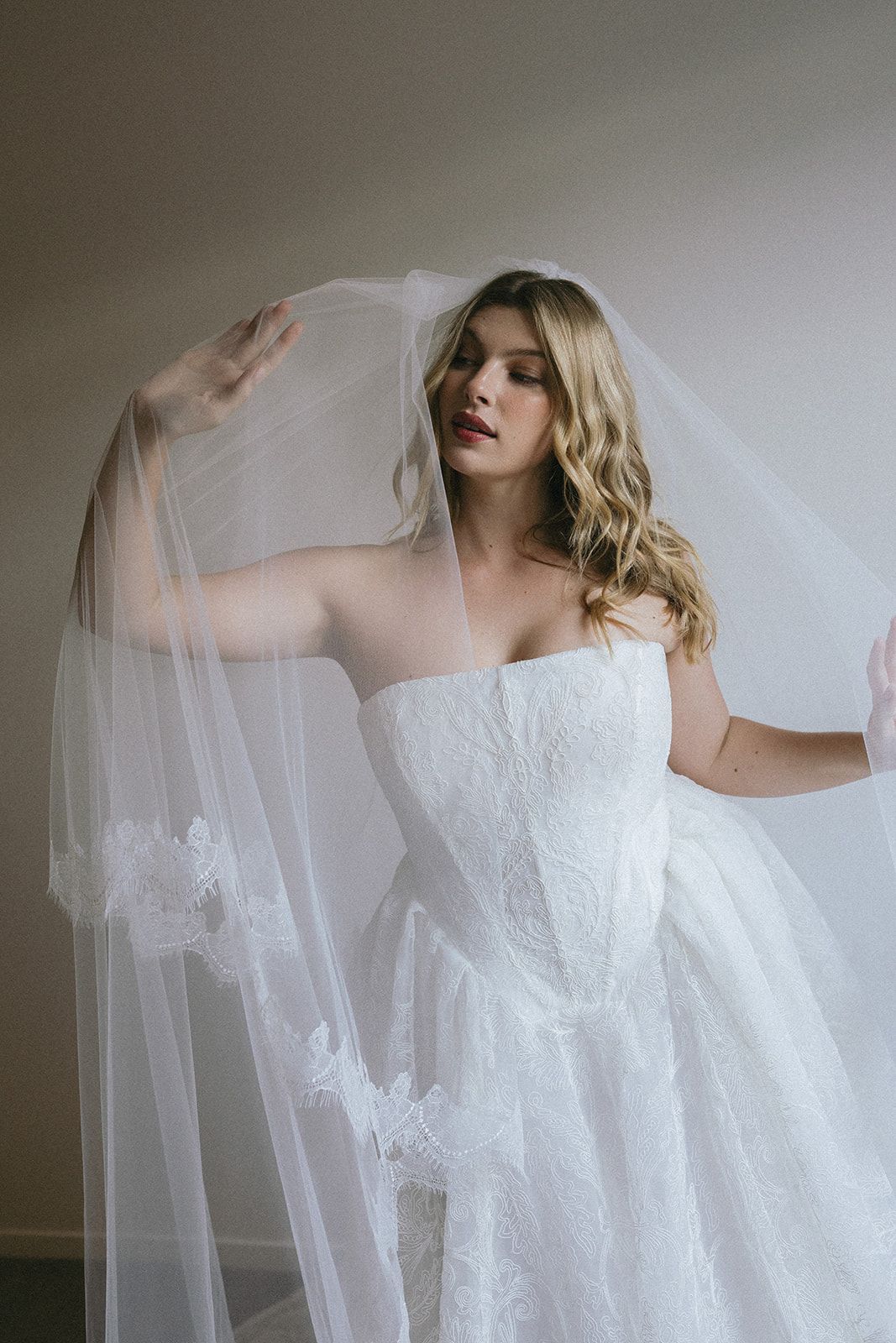 model wearing a bridal gown and veil