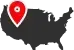 A black silhouette of the United States map featuring a red location pin over the Pacific Northwest region.