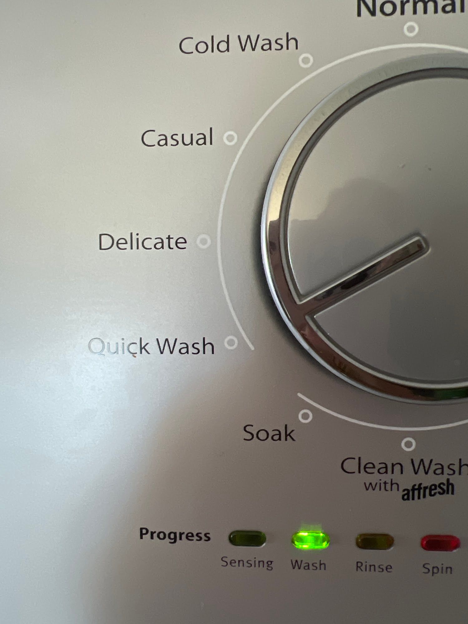Washing machine control panel: cycle selector dial set to 