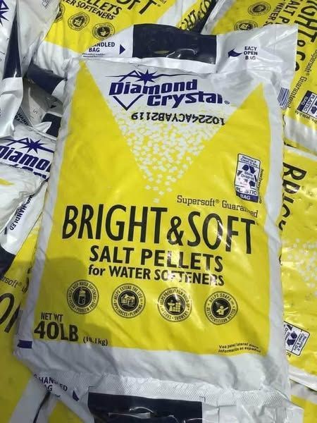 A bag of bright and soft salt pellets for water softeners